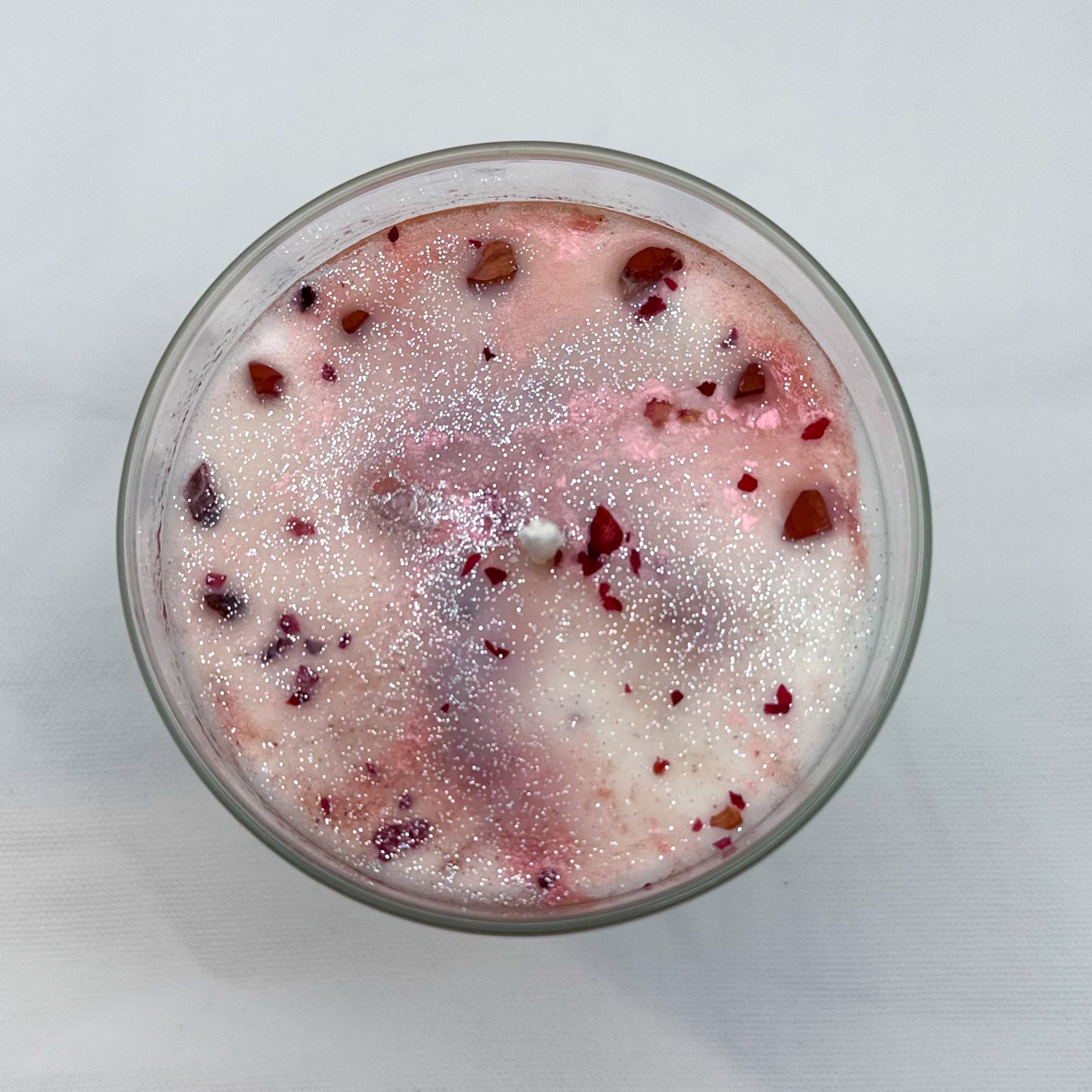Close-up of Rooted in Harvest fall candle showing natural ingredients and spiritual intention