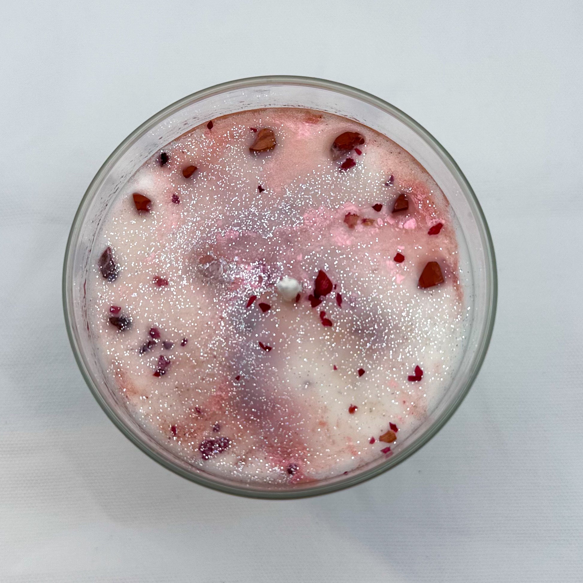 Close-up of Rooted in Harvest fall candle showing natural ingredients and spiritual intention